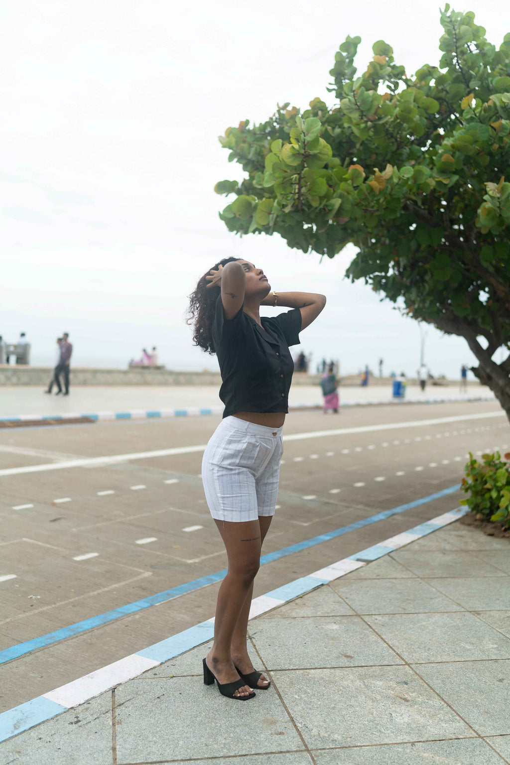 Button -down Black shirt and White Shorts