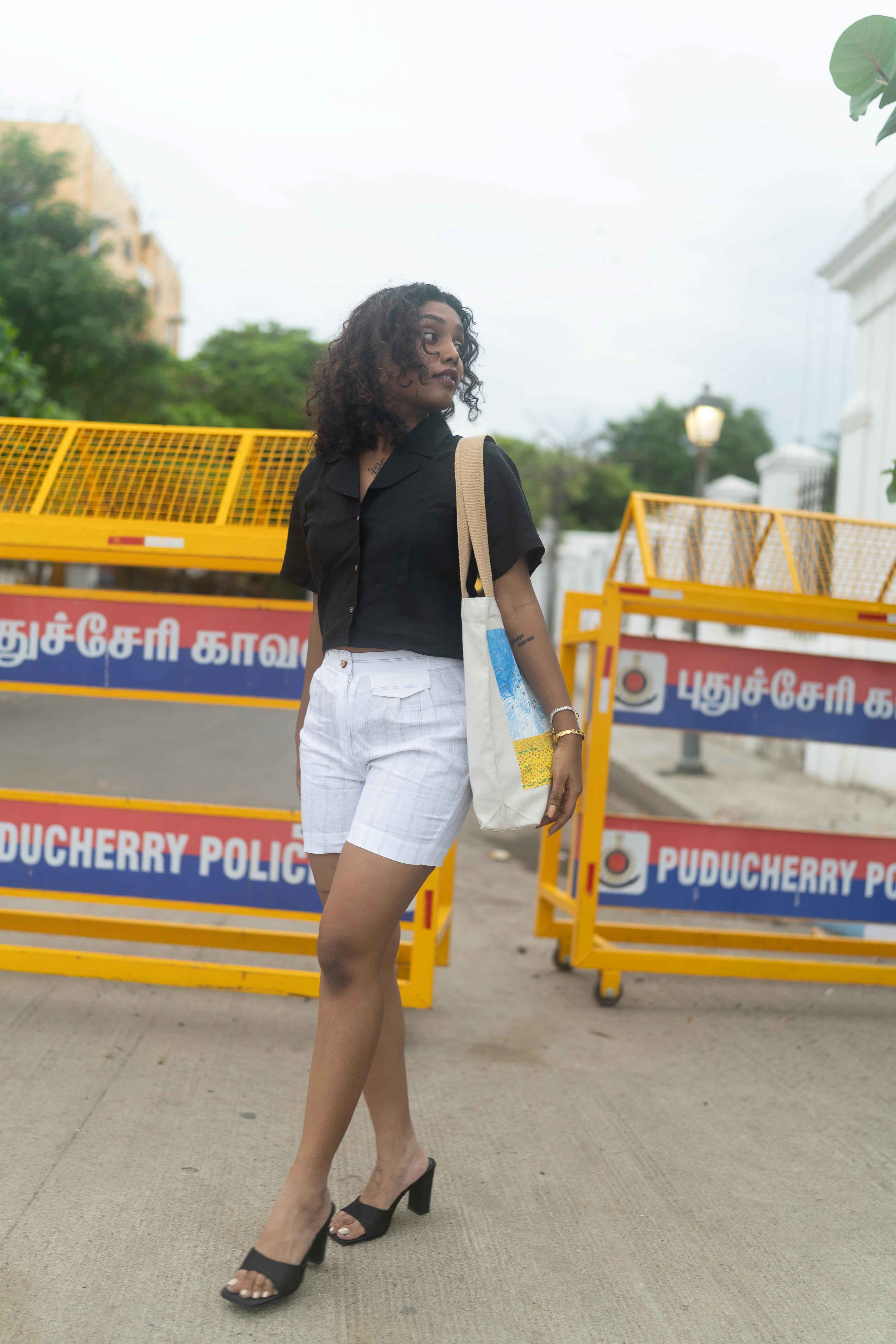 Button -down Black shirt and White Shorts